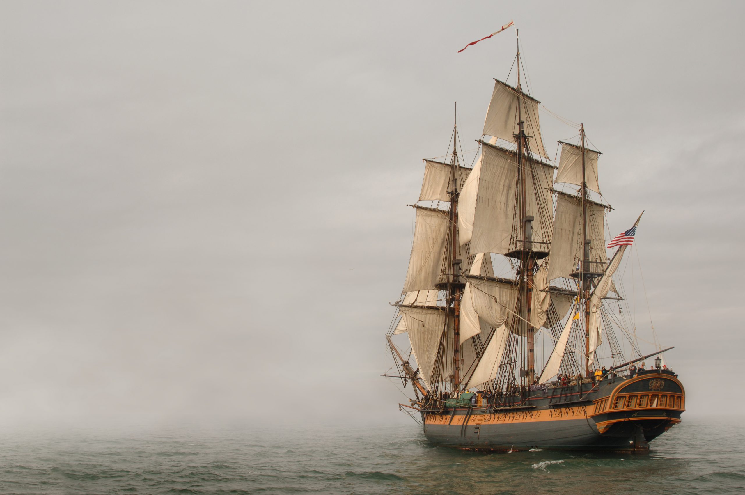 Vintage Frigate sailing into a fog bank